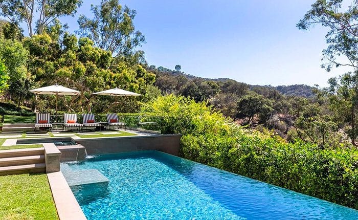 Pool side at a Regency Style Beverly Hills Estate. Luxury living at its finest.