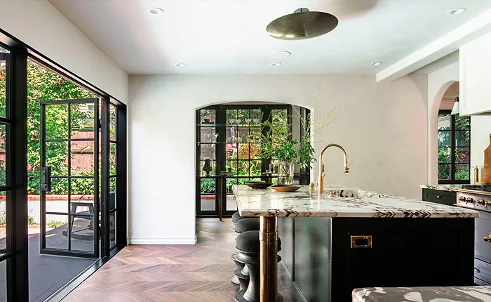 The heart of this Los Feliz English Tudor home lies in the kitchen, a striking blend of warmth, functionality, and unabashed elegance. 