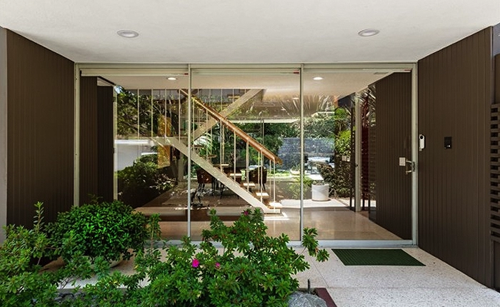 Laurel Canyon Mid Century Modern with floor to ceiling glass entry