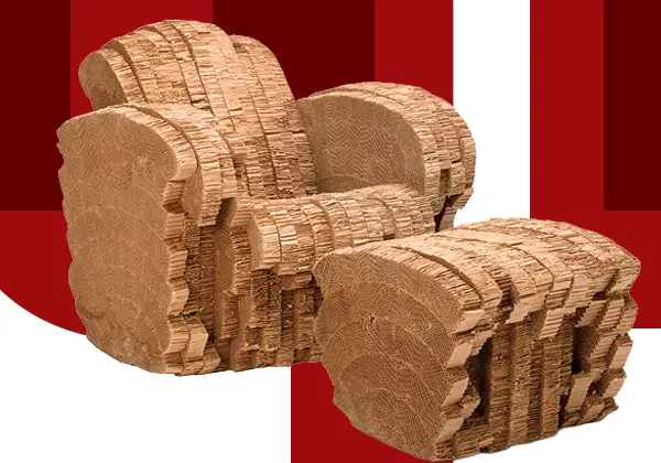 The Beaver Chair and Ottoman, designed by Frank Gehry, features layered corrugated cardboard with irregular, organic edges, displayed against a bold red and white geometric background.